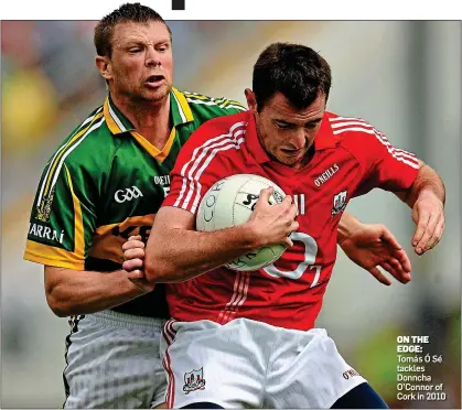  ?? ?? ON THE EDGE: Tomás Ó Sé tackles Donncha O’Connor of Cork in 2010