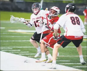  ?? Lindsay Perry / for Hearst Connecticu­t Media ?? New Canaan’s Zachary Miller and Fairfield Prep’s Ethan Grandolfo collide as they compete for control of the ball during the Jesuits’ 9- 7 loss Saturday.