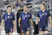  ?? MICHAEL WYKE — THE ASSOCIATED PRESS ?? United States women’s national team players, from left, Kelley O’Hara, Alex Morgan and Kristie Mewis, are looking for equal pay to the men’s national team in their new contract.