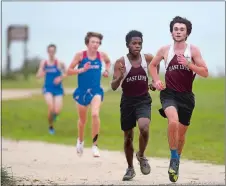  ?? SARAH GORDON/THE DAY ?? Earlier this week, the ECC's post
East Lyme High School’s Fisher Macklin leads teammate Ben Rukundo during a cross country meet Monday at Rocky Neck State Park.