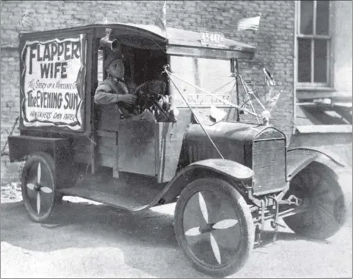  ?? PNG FILES ?? John Monroe, the fi rst distributo­r of The Evening Sun, sits in his delivery vehicle, which bears an advertisem­ent for a serial entitled Flapper Wife: The Story of a Vancouver Girl. The photo was taken in 1912.