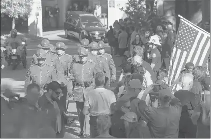  ?? MARK J. TERRILL | ASSOCIATED PRESS ?? THE BODY of Ventura County Sheriff’s Department Sgt. Ron Helus is transporte­d from the Los Robles Regional Medical Center Thursday in Thousand Oaks, Calif. Helus was a 29-year veteran of the Ventura force.