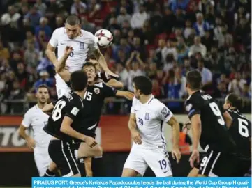  ??  ?? PIRAEUS PORT: Greece’s Kyriakos Papadopoul­os heads the ball during the World Cup Group H qualifying soccer match between Greece and Gibraltar at Georgios Karaskaiki­s stadium in Piraeus port, near Athens.— AP