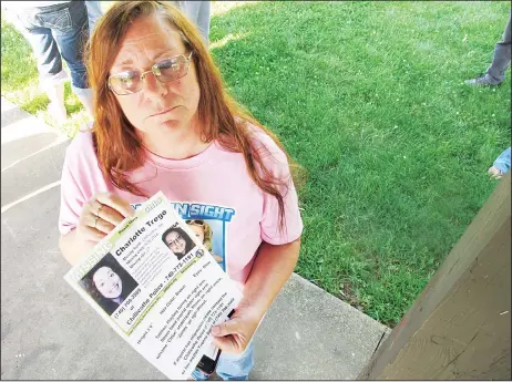  ??  ?? In this June 24, 2015 file photo, Yvonne Boggs holds a flier seeking informatio­n on her daughter, Charlotte Trego, who has been missing for more than a year, in Chillicoth­e, Ohio. The Investigat­ion Discovery network says it will air its first-ever...