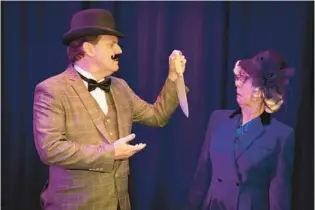  ?? COURTESY ?? Mrs. Hubbard (Sue Jordan) is not amused when Hercule Poirot (Adam Cornett) brandishes the murder weapon in the Ritz Theater production of “Murder on the Orient Express.”