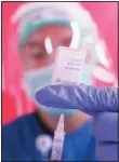  ??  ?? A health worker prepares a syringe of the AstraZenec­a vaccine during a mass coronaviru­s vaccinatio­n campaign for public transport workers at the Kampung Rambutan Bus Terminal in Jakarta, Indonesia, Thursday, June 10. (AP)