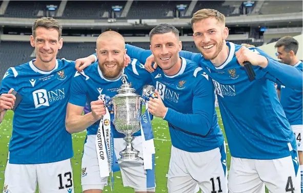  ?? ?? St Johnstone won a historic cup double (pictured are Craig Bryson, Shaun Rooney, Michael O’Halloran and Jamie McCart with the Scottish Cup trophy).