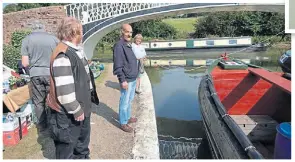  ?? PHOTO: TIM COGHLAN ?? Former working boatman Ron Withey, 81, approving the butty Raymond’s recent makeover, with chairman Clare Hewitt holding the mooring line.