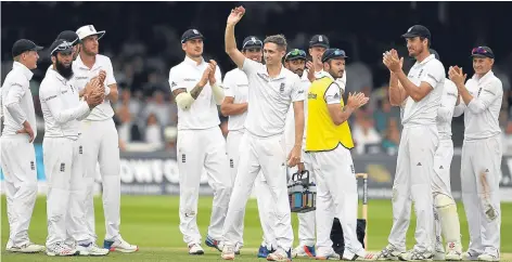  ??  ?? Chris Woakes holds up the ball after picking up his fifth wicket of the innings at Lord’s yesterday.