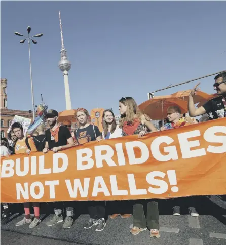  ?? PICTURE: SEAN GALLUP/GETTY ?? 0 Protesters in Berlin call for an open society and decry increasing divisions in Europe