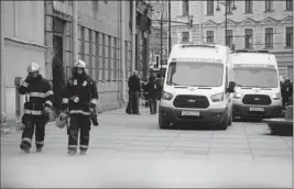  ?? ASSOCIATED PRESS ?? RUSSIAN EMERGENCY SERVICE PATROL AN AREA near the Tekhnologi­cheskaya metro station after an explosion in the St. Petersburg subway in St. Petersburg, Russia, on Monday, with fatalities and many injured in the subway train blast.