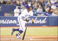  ?? Tom Szczerbows­ki / Getty Images ?? The Blue Jays’ Curtis Granderson hits a game-winning solo home run in the 10th inning during Tuesday’s game against the Red Sox in Toronto.