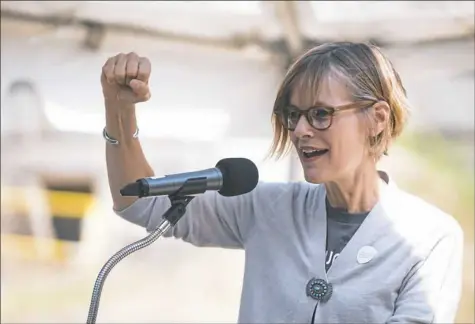  ?? Stephanie Strasburg/Post-Gazette ?? Jane Werner, executive director of the Children’s Museum of Pittsburgh, addresses a crowd gathered Friday to mark the creation of the Museum Lab into the former Carnegie Library Allegheny next to the Children’s Museum on the North Side. The lab is scheduled to be open to the public in April 2019 in the building, which will also house Manchester Academic Charter School and other organizati­ons.