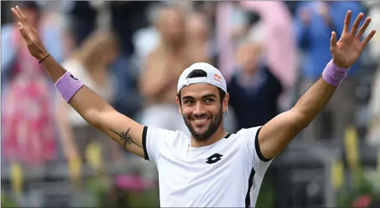  ??  ?? Matteo Berrettini celebrates winning the final at Queen’s, having got the better of Cameron Norrie, below, in three sets