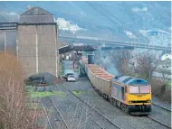  ?? ?? GBRf Class 60 No. 60087 reverses its train of 23 JNA wagons under the loader at Penmaenmaw­r on December 20, having arrived with 6D60, the 07.08 departure from Tuebrook.