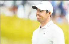  ?? Warren Little / Getty Images ?? Rory McIlroy reacts to his shot on the 14th green during the second round of the U.S. Open at Shinnecock Hills Golf Club on Friday in Southampto­n, N.Y.