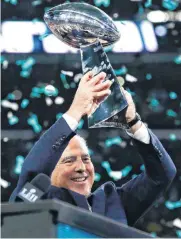  ?? [AP PHOTO] ?? Philadelph­ia Eagles owner Jeffrey Lurie hoists the Vince Lombardi Trophy after his team won the Super Bowl LII against the New England Patriots on Sunday in Minneapoli­s. The Eagles won 41-33.