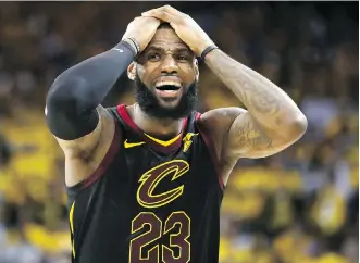  ?? EZRA SHAW/GETTY IMAGES ?? LeBron James saw a potential win turn into an overtime loss Thursday during Game 1 of the NBA final as Cleveland teammate JR Smith passed up a shot at the buzzer in a 124-114 Golden State win.