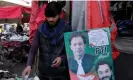  ?? Photograph: KM Chaudary/AP ?? A street vendor shows his allegiance to Imran Khan’s party.