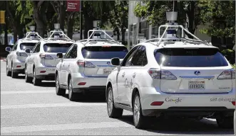  ?? ERIC RISBERG / ASSOCIATED PRESS 2014 ?? A row of Google self-driving cars sits outside the Computer History Museum in Mountain View, Calif. The graphics processing unit is central to how an autonomous vehicle determines whether an object in the road is an obstacle or a traffic light.