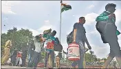  ??  ?? Migrants outside a railway station in Hyderabad.