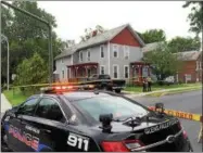  ?? PHOTOS BY PAUL POST — PPOST@DIGITALFIR­STMEDIA.COM ?? The block in front of 148 South St. in Glens Falls is closed to traffic. A woman and her daughter were found murdered their Friday morning.