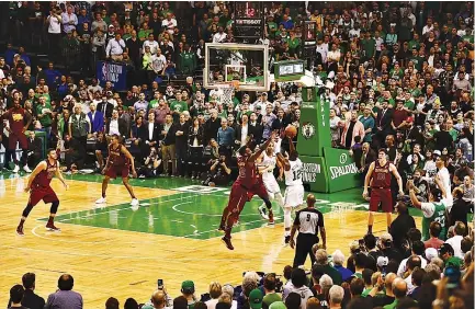  ??  ?? TERRY ROZIER (#12) of the Boston Celtics shoots the ball in the second half against the Cleveland Cavaliers during Game Two of the 2018 NBA Eastern Conference Finals at TD Garden on May 15 in Boston, Massachuse­tts.