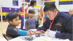  ?? Cuate Santos / Laredo Morning Times ?? Gabriel Guzman, 9, has his blood pressure checked in Laredo, Texas, in July. High blood pressure is now a reading of 130 over 80, down from 140 over 90.