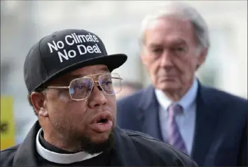  ?? Win McNamee/Getty Images ?? The Rev. Lennox Yearwood, part of the Hip Hop Caucus, speaks at a news conference on funding climate change legislatio­n Thursday outside the U.S. Capitol in Washington. Behind him is Sen. Ed Markey, D-Mass.