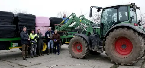  ??  ?? At the distributi­on of fodder in Ballycogle­y on Friday: David Ryan (Wicklow), Eamonn Doyle (Tomcoole, Taghmon), Adrian Morrissey (Murrintown), David Power (Tagoat), Onnagh D’Arcy, John Wright (Killinick) and Tom Coleman (Piercestow­n) driving the tractor.