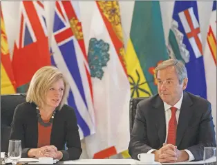  ?? CP PHOTO ?? Alberta Premier Rachel Notley and Canada’s ambassador to the U.S. David Macnaughto­n talk during the Council of Federation meetings in Edmonton Alta., Tuesday.