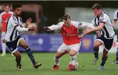  ?? Reuters ?? Arsenal’s Jack Wilshere (centre) in action against West Bromwich Albion in the Barclays Under-21 Premier League, a game in which the returning midfielder scored.