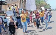  ?? ?? ANC supporters protested outside Scottburgh Magistrate’s Court where two police officers appeared for the murder of an ANC councillor and his two friends. | BOITUMELO PAKKIES ANA