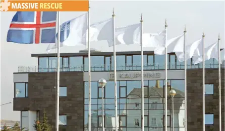  ?? — Reuters ?? The Iceland flag flies next to the headquarte­rs of Kaupthing Bank in Reykjavik, Iceland.