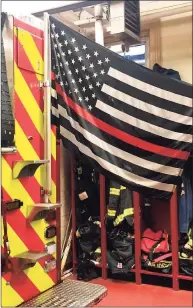  ?? Contribute­d photo / Middletown Profession­al Firefighte­rs ?? A "Thin Red Line" flag, honoring fallen firefighte­rs, was stolen off a Middletown Fire Department vehicle during a call Friday.