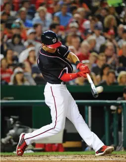  ?? (Reuters) ?? WASHINGTON NATIONALS center fielder Trea Turner hits a solo home run against the San Francisco Giants during the Nats’ 5-1 home victory on Friday.