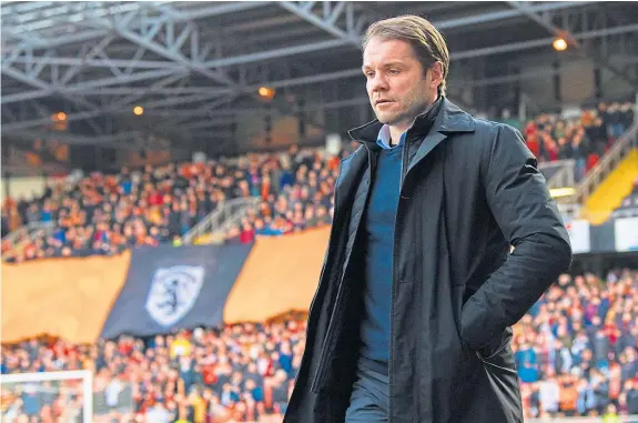  ?? Picture: SNS. ?? Robbie Neilson insists United’s players remain fully committed to delivering the Ladbrokes Championsh­ip title to Tannadice.