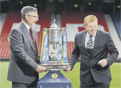  ??  ?? 0 Craig Levein and Neil Lennon are in jovial mood as they pose with the Scottish Cup at Hampden ahead of tomorrow’s final.