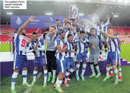  ??  ?? The jubilant Porto squad celebrate their success