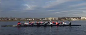  ?? Bradley E. Clift / For Hearst Connecticu­t Media ?? Racing each other on the water, the UConn varsity crew team takes on the underclass­men as the two teams battle it out on the Norwalk River.