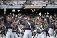  ??  ?? U.S. Military Academy cadets celebrate Saturday at the end of their graduation ceremony at Michie Stadium in West Point, N.Y. (AP/Eduardo Munoz Alvarez)