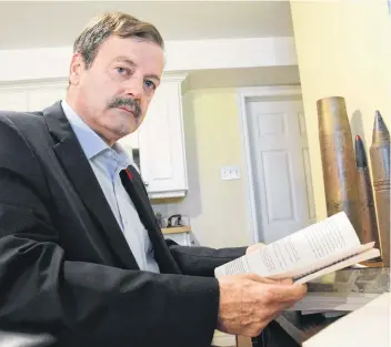  ?? ERIN POTTIE/CAPE BRETON POST ?? Underwater munitions expert Terry Long is pictured at his Leitches Creek home in this file photo.