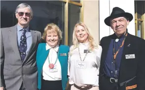  ??  ?? From left, Gary Pennington, Ann Edenfield, Paul Burns and Don Shapiro, all representi­ng the nonprofit Wings for Life, stand at the state Capitol before being presented with an award last month.