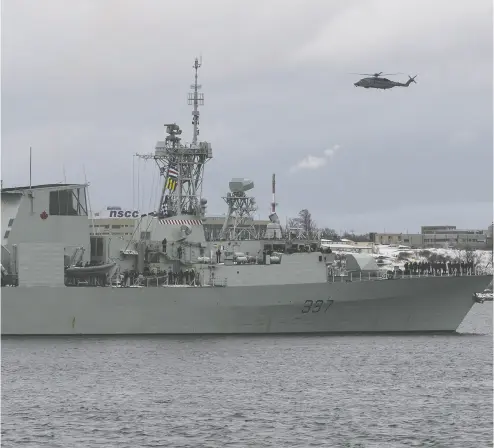  ?? Darr
en Calabrese / the cana dian press files ?? A Cyclone helicopter flies over HMCS Fredericto­n as it leaves Halifax for a six-month deployment to the Mediterran­ean Sea on Jan. 20. Fredericto­n’s ship-borne Cyclone crashed April 29, killing all six aboard.