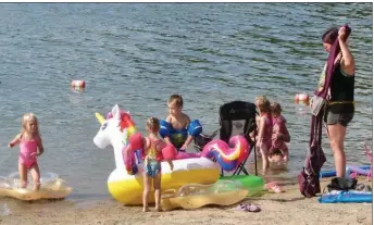  ?? (Special to the Democrat-Gazette/Marcia Schnedler) ?? Toys are popular at the beach by Three Sisters Springs at Lake Ouachita State Park.