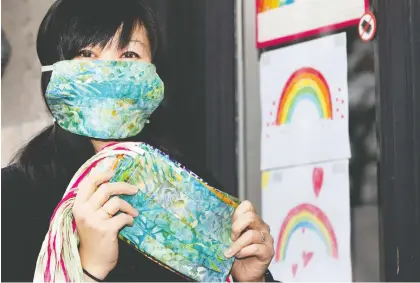  ?? ALLEN MCINNIS ?? Vivian Doan says sewing protective masks for health-care workers has helped channel her energy and ease her anxiety about COVID-19.