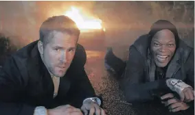  ??  ?? Ryan Reynolds and Samuel L. Jackson in “The Hitman’s Bodyguard.”
