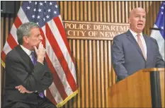  ?? Bebeto Matthews / Associated Press ?? Mayor Bill deBlasio, left, listens Thursday as Police Commission­er James P. O’Neil speaks during a news conference on the latest in the package bomb investigat­ion in New York.
