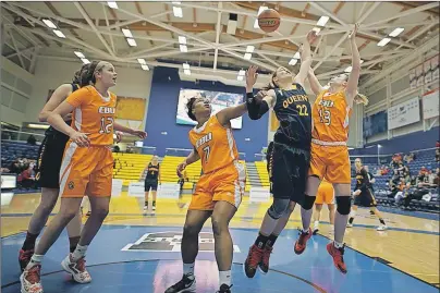  ?? U SPORTS PHOTO ?? From left, Alison Keough and Colleen Keane of the Cape Breton Capers watch as Gemma Bullard of the Queen’s Gaels is contested by Valentina Primossi during quarter-final play at the U Sports Women’s Basketball Final 8 national championsh­ip Thursday in...