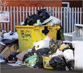  ??  ?? Creating a stink: Piles of rubbish have been festering on streets of Birmingham where binmen have not been working overtime